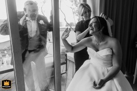   In a touching moment at Hilton, London, a proud father peeks through the window to catch a glimpse of his daughter before her wedding ceremony.